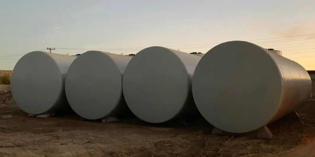 Stationary fuel storage tanks at a gas station Stationary cylindrical tanks for fuel storage at a gas station